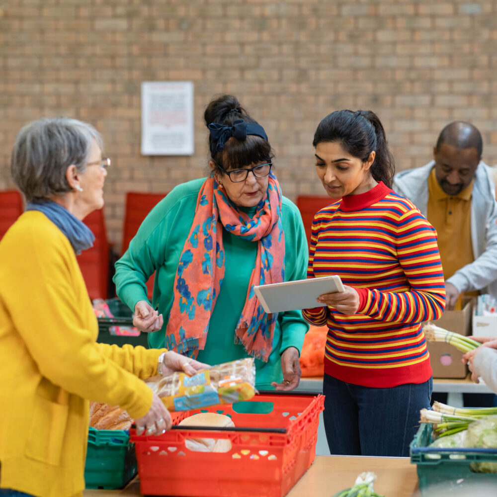 A group of women working at a food bank